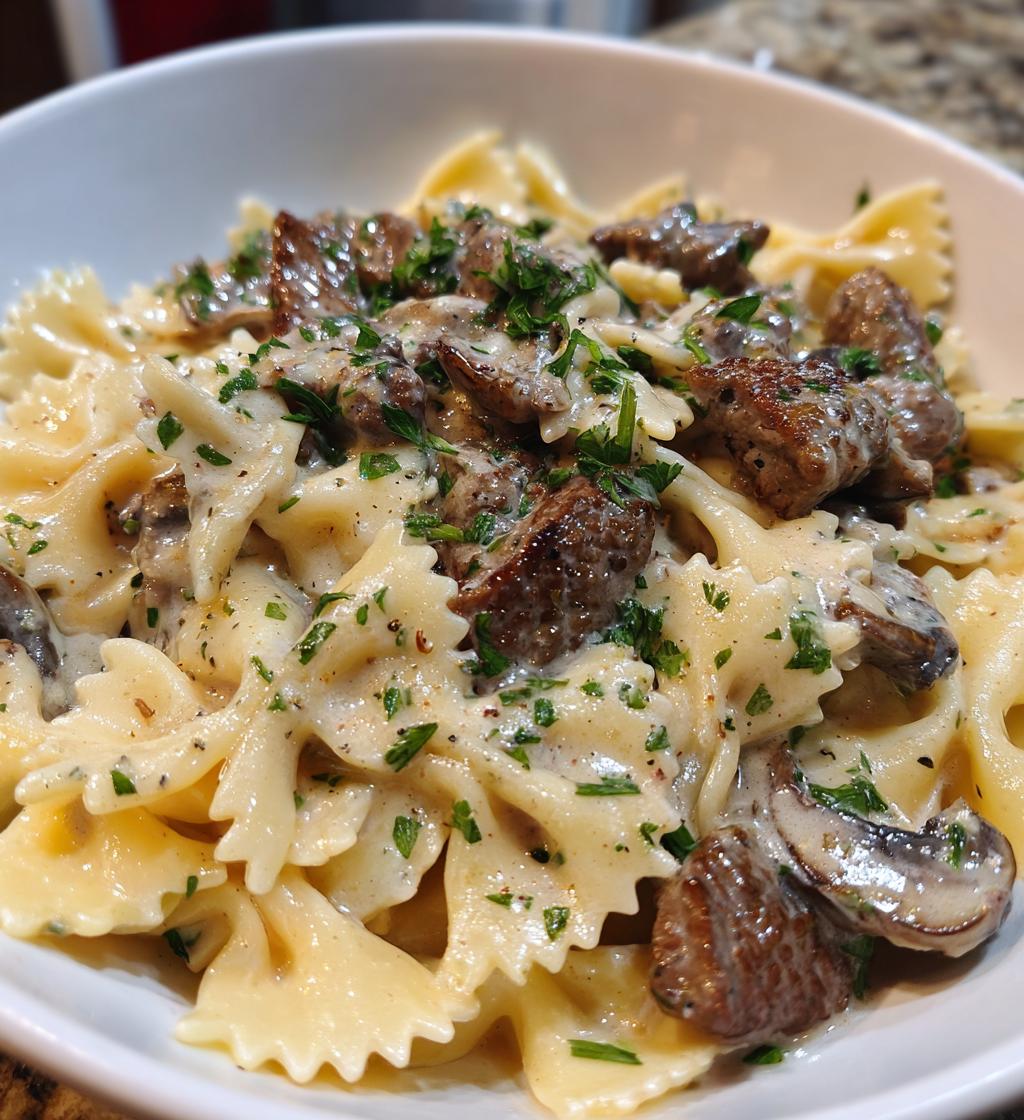 beef and bowtie pasta with alfredo sauce - detail 1