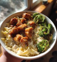 hot honey garlic chicken bites cajun alfredo with crispy broccoli twists